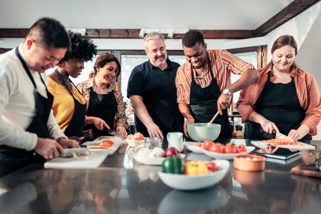 A group of people in a class learning to cook on a budget.
